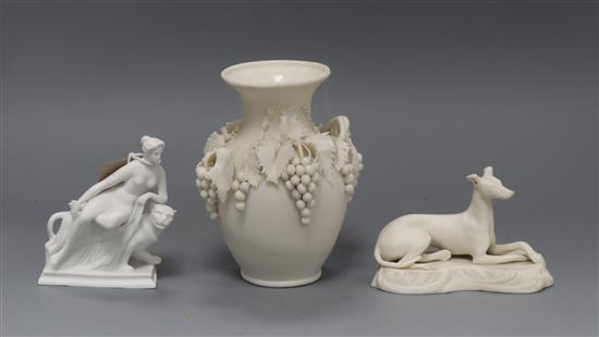 A Parian encrusted vase, a Copeland parian ware Greyhound and another piece